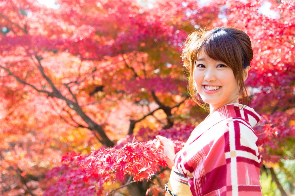 asian woman wearing japanese kimono in fall