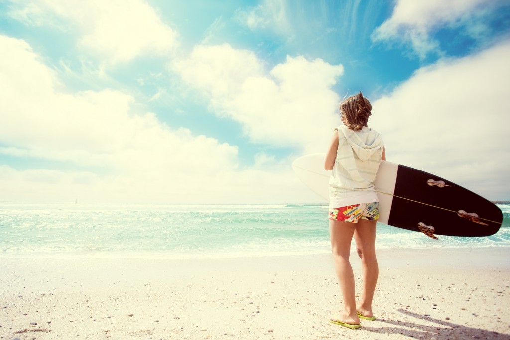 Surfer girl on the beach