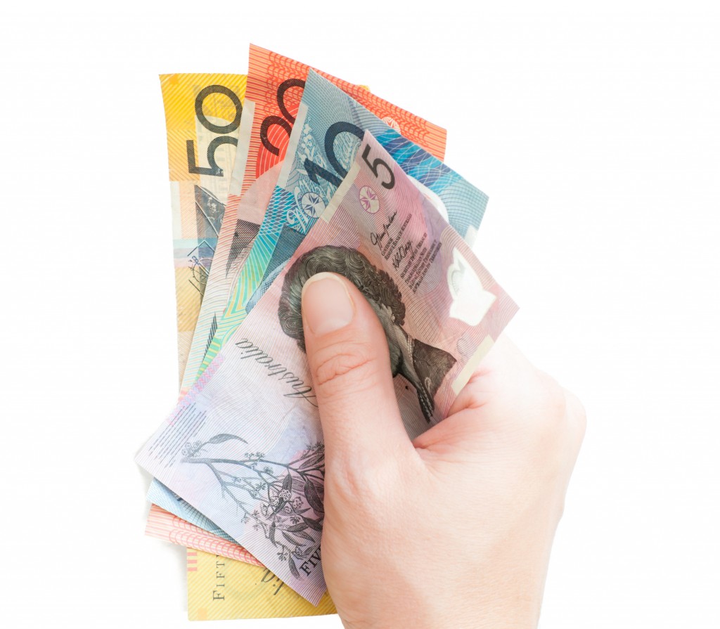 Hand holding Australian money bank notes